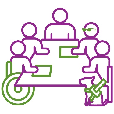 A group of people, some with visible disability, working together around a table.