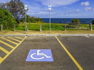 An accessible parking space near a beach.