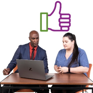2 people using a computer. Above them is a thumbs up.